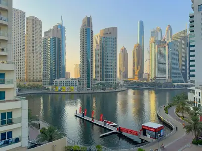 a view of a city with a river and buildings at DreamLike Full Pool & Marina View Apartment Dubai in Dubai