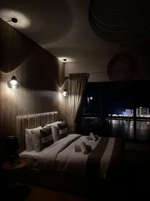 a bedroom with a large bed with white pillows at Dubai Eye & Sea View, 1-min walk to JBR Beach, Luxurious Beach Retreat! in Dubai
