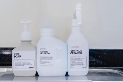 a group of three bottles sitting on a shelf at Dubai Modern Apartment l Sleeps 4 l 2 Baths in Dubai
