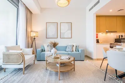 a living room with a blue couch and a table at Alluring 1BR with Marina View at 5242 Tower 2 Dubai Marina by Deluxe Holiday Homes in Dubai