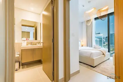 a bedroom with a bed and a bathroom with a window at Alluring 1BR with Marina View at 5242 Tower 2 Dubai Marina by Deluxe Holiday Homes in Dubai