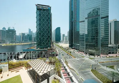 a view of a city with tall buildings and a highway at Lux Studio in Downtown - Damac Maison Prive - Near Burj Khalifa in Dubai