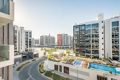 an aerial view of a city with tall buildings at Inviting 1BR Apartment in Azizi Riviera 32, Al Merkadh by Deluxe Holiday Homes in Dubai
