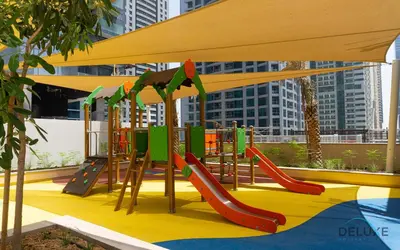 a playground with a slide and a slide at Chic 1BR in The Residence at Marina Gate 2, Dubai Marina by Deluxe Holiday Homes in Dubai