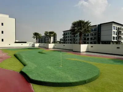 a miniature golf course on the roof of a building at Cozy Studio with sun terrace in Dubai