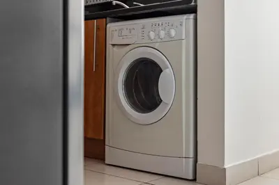 a washer and dryer in a room at StoneTree - Newly Furnished - Near Metro in Dubai
