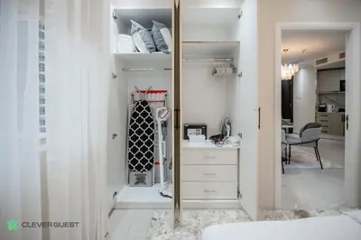 a bedroom with a mirror and a dresser in a room at Clever Guest 025 Dubai Gate 1 in Dubai