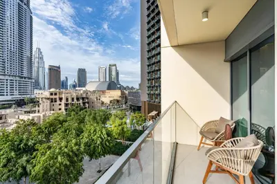a balcony with chairs and a view of the city at Stunning Renovated Home with Full Burj Khalifa View in Dubai