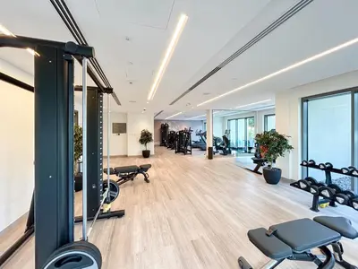 an empty gym with cardio equipment in a building at Stunning Renovated Home with Full Burj Khalifa View in Dubai