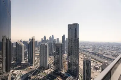 an aerial view of a city with tall buildings at Escape24 2BR in Address Opera with Skyline Views near Burj Khalifa in Dubai