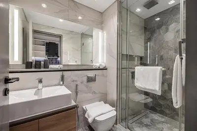 a bathroom with a sink and a toilet and a shower at Studio MAG 318 City View Business Bay in Dubai