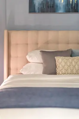 a close up of a bed with pillows at GuestReady - Sky-High Comfort at Dubai Hills in Dubai