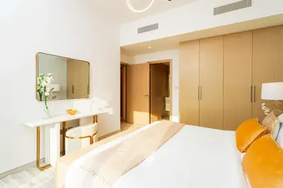 a bedroom with a bed and a desk and a mirror at Elite Royal Apartment - Sky Series - Full Panoramic Burj Khalifa & Fountain View - Icon in Dubai