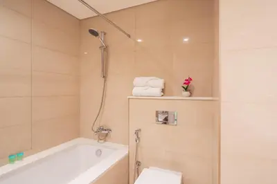 a bathroom with a bath tub and a toilet at Elite Royal Apartment - Sky Series - Full Panoramic Burj Khalifa & Fountain View - Icon in Dubai