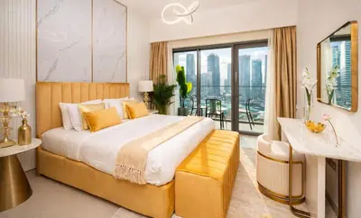 a bedroom with a large bed and a balcony at Elite Royal Apartment - Sky Series - Full Panoramic Burj Khalifa & Fountain View - Icon in Dubai