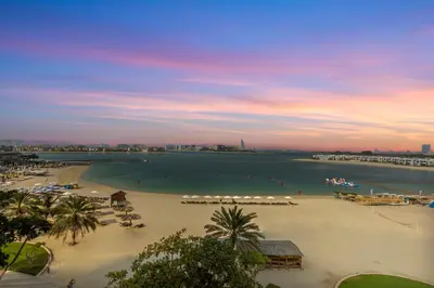 a view of a beach with a large body of water at Exquisite 1BR with Private beach in Palm Jumeirah in Dubai