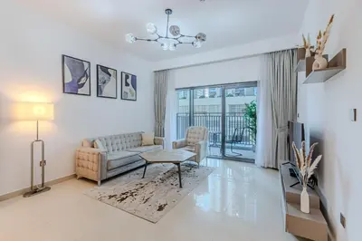 a living room with a couch and a table at New I Modern I 1BDR I 17 Icon Bay Tower 2 in Dubai