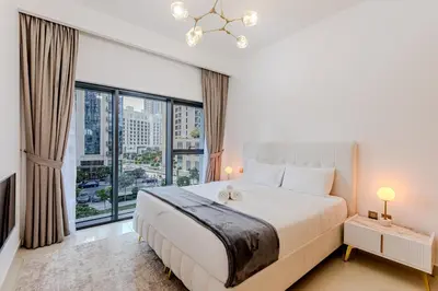 a bedroom with a large bed and a large window at New I Modern I 1BDR I 17 Icon Bay Tower 2 in Dubai