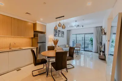 a kitchen and dining room with a table and chairs at New I Modern I 1BDR I 17 Icon Bay Tower 2 in Dubai