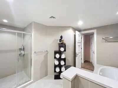 a bathroom with a walk in shower and a glass shower stall at Golden Mile 1 - Contemporary One Bedroom in Dubai