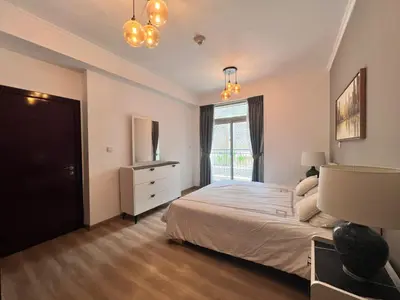 a bedroom with a large bed and a window at Luxurious 1BR in Burj Views Podium, Downtown in Dubai