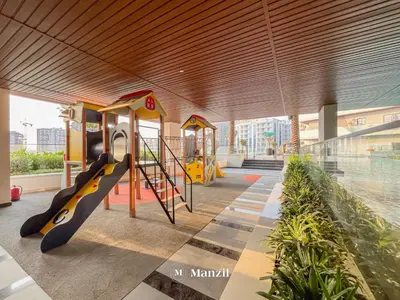 a playground in a building with a slide and a slideintend at Manzil - 1BR Apartment in Marquis Signature with City Views in Dubai