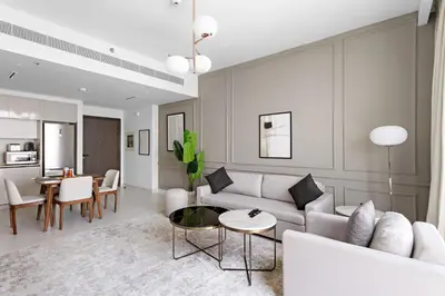 a living room with a couch and a table at Silkhaus Sea View Stunning 1BDR with Private Beach in Dubai
