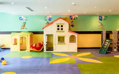 a play room with a toy house and a slide at Elite Royal Apartment - Full Burj Khalifa & Fountain View - Luxurious - Viceroy in Dubai