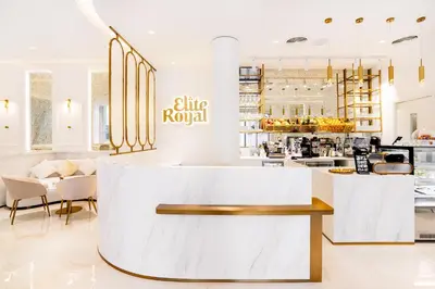 a lobby of a restaurant with a white counter at Elite Royal Apartment - Full Burj Khalifa & Fountain View - Luxurious - Viceroy in Dubai