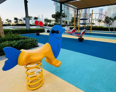 a playground with a toy dolphin and a slide at Burj Crown - Downtown Elegance Opera Boulevard View by Dubai Mall in Dubai