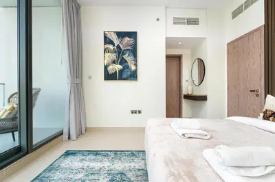 a bedroom with a bed and a window at Vacay Lettings - Liv Residence in Dubai