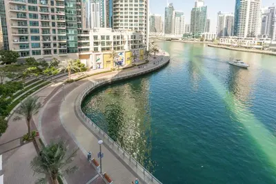 a view of a river in a city with tall buildings at Vacay Lettings - Liv Residence in Dubai