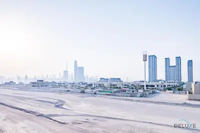 a view of a city with tall buildings at Delightful Studio Apartment in Azizi Riviera 20, Al Merkadh by Deluxe Holiday Homes in Dubai