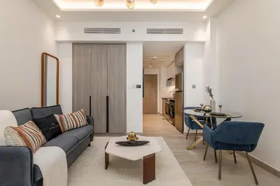 a living room with a couch and a table at Apartments in ME DO RE Jumeirah Lake Towers in Dubai