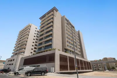 a car parked in front of a large building at StoneTree - Modern Apartment - Brand New in Dubai