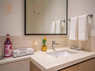 a bathroom with a sink and a mirror at Top Floor Home with Amazing City Views 188BC-2 in Dubai