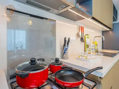 two pots and pans on a stove in a kitchen at Top Floor Home with Amazing City Views 188BC-2 in Dubai