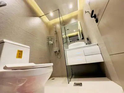 a bathroom with a toilet and a sink at Sea Front Living, Upgraded 2BR Apartment, Escan Tower, Dubai Marina in Dubai