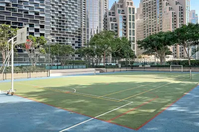 a tennis court in the middle of a city at FIRST CLASS 1BR Burj Khalifa & Fountain Views in Dubai