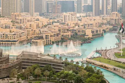 a view of a city with a river and buildings at FIRST CLASS 1BR Burj Khalifa & Fountain Views in Dubai