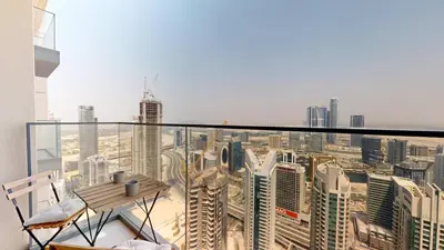 a balcony with a view of a city at Vacationer I Modern 1 Bed High-Floor Stay I City Skyline View I Burj Royale I Downtown in Dubai