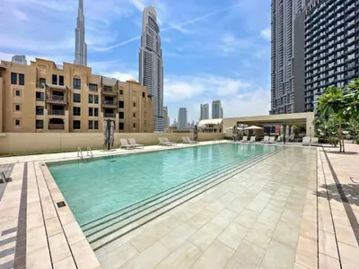 a large swimming pool on top of a building at Vacationer I Modern 1 Bed High-Floor Stay I City Skyline View I Burj Royale I Downtown in Dubai
