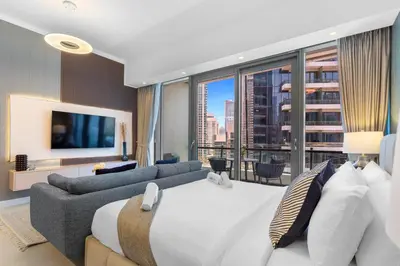 a hotel room with a large bed and a large window at Stylish Studio with Premium Features in Marina in Dubai