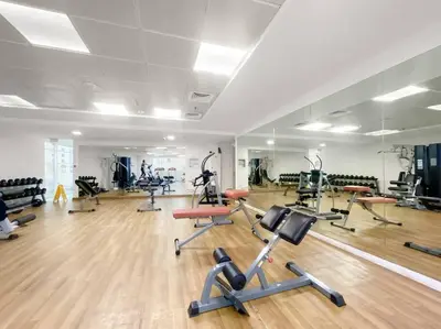 a gym with several treadmills and exercise bikes at Luxury 2BR with Stunning Dubai Marina Views Near JBR Beach in Dubai
