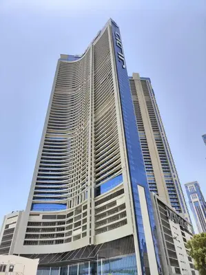 a tall building with a sign on the side of it at Upgraded Downtown Dubai 2 BD in Dubai