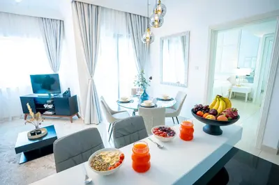 a living room with a table with a bowl of fruit at New Listing & Burj Khalifa View & Dubai Mall in Dubai