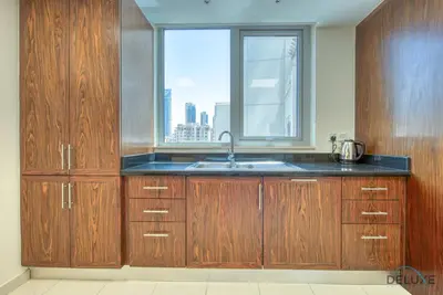 a kitchen with a sink and a window at Burj Khalifa Lake Vicinity Perfect 1BR Escape, Residences 7, Downtown Dubai by Deluxe Holiday Homes in Dubai