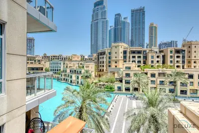a view of the city from the balcony of a building at Burj Khalifa Lake Vicinity Perfect 1BR Escape, Residences 7, Downtown Dubai by Deluxe Holiday Homes in Dubai