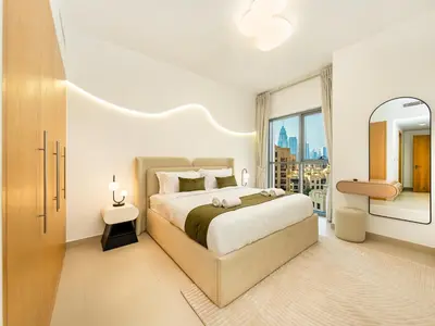 a bedroom with a large bed and a large window at Stunning Two Bedroom Apartment with Private Balcony & Burj Khalifa by Luxury Space in Dubai