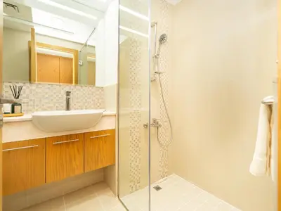 a bathroom with a sink and a shower at Stunning Two Bedroom Apartment with Private Balcony & Burj Khalifa by Luxury Space in Dubai
